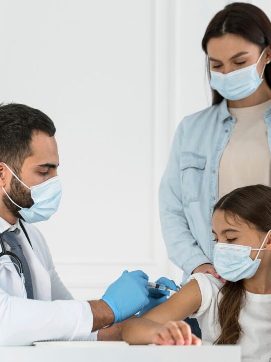 male-doctor-vaccinating-little-girl_23-2148755612