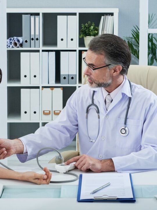 medium-shot-doctor-checking-blood-pressure-female-patient_1098-19334